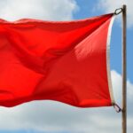 life guards red warning flag on the beach